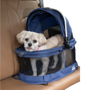 a close up image of a dog in the car seat inside a Midnight River View 360 Carrier