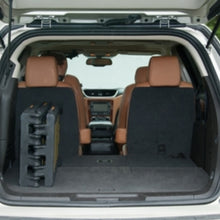 an image tri fold ramp at the back of the car 