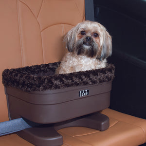 A close up image of a shih-tzu sitting on a brown leather car seat in a Bucket Seat Dog Booster with Chocolate Insert, 17"