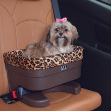 A close up image of a shih-tzu sitting on a brown leather car seat inside a Bucket Seat Dog Booster with Jaguar Insert, 17"