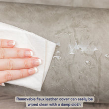 a close up image of a lady's hand wiping a wet surface with a white clean cloth