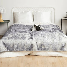 a french bulldog sleeping on a white bed in a white and grey fluffy dog blanket in an all white modern bedroom with  bedside table with lamps 