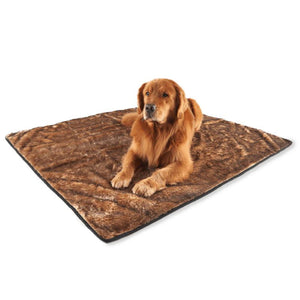 a golden retriever laying on a brown dog blanket with white background