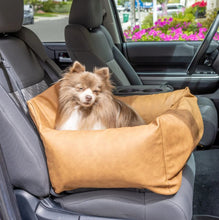 a cute pomeranian sitting at the passenger seat on a car with grey leather seats on a brown car dog bed with beautiful flowers on the background