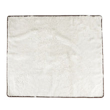 a laid out white dog blanket with white background