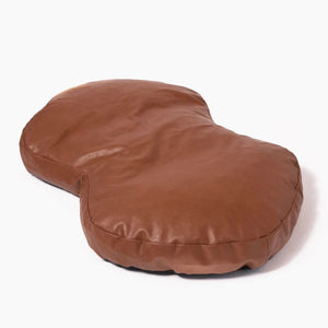 a brown leather dog bed 