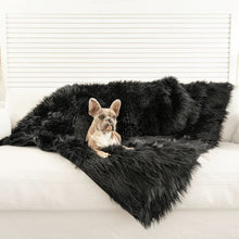 a french bulldog laying on a black furry dog blanket on top of a white couch in an all white living room setting 