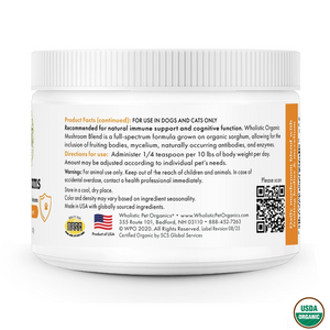 
A white plastic jar of "WHOLISTIC PET ORGANICS MUSHROOMS" for dogs and cats. The back label provides product facts, including usage directions to "Administer 1/4 teaspoon per 10 lbs of body weight per day." It also notes the product is for "natural immune support and cognitive function," with warnings, storage information, and contact details for the company. There is a QR code on the right side of the label.