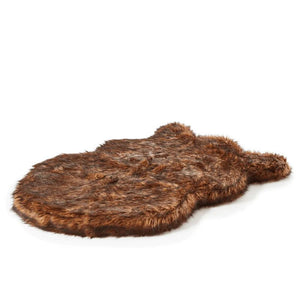 a brown fluffy dog bed with white background 