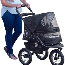 a close up image of a black stroller with dalmatian inside bolster pad and roofing