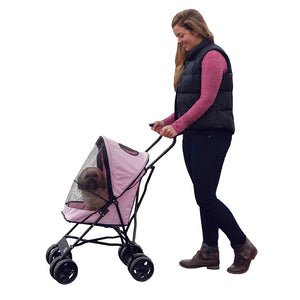 a woman walking her dog in a pink stroller with white backround