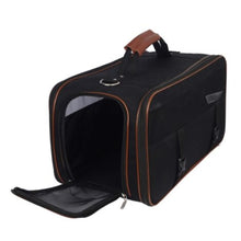 a black dog carrier with brown handle and accents with an opened side entry