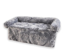a grey fluffy couch lounger with white background 