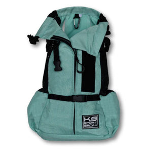 a front view image of an open light blue dog backpack with side pockets and safety lock inside it 