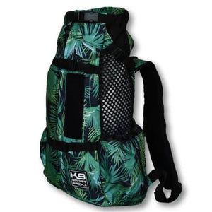 side view image of a green jungle themed dog backpack with side pockets