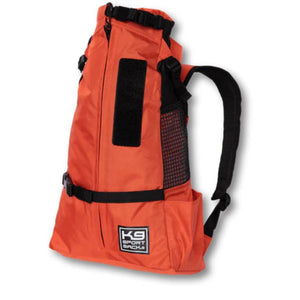 side view image of an orange dog backpack carrier with side pockets