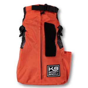 front view image of an orange dog backpack carrier with side pockets