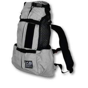 semi side view image of a grey dog backpack carrier with side pockets 