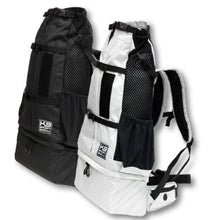 a black and white dog backpack carrier with side pockets 
