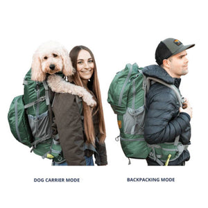 a woman carrying her dog on her back in a green dog backpack carrier and a man wearing a black cap carrying a green dog backpack carrier 