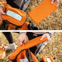 split image of a lady taking out a foam out of its cover from an orange dog backpack harness