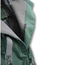 a close up image of a green dog backpack carrier showing an unzipped side of it near the safety strap