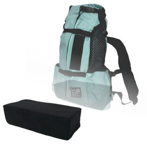 A blue pet backpack and black booster block