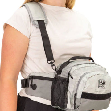 a woman in white wearing a white shoulder and hip bag 