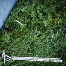 an image of tent locks on the grass 