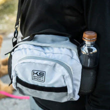 close up image of a shoulder and hip bag with a water bottle on its side pockets