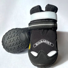 Close up image of a pair of black dog boots