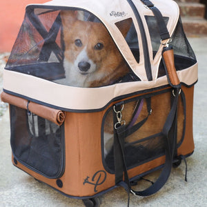 close up image of a dog inside a brown dog carrier with wheels 