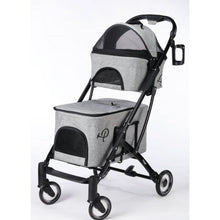 Full view image of a gray dog stroller and carrier with black frames and four wheels facing left 