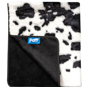 A waterproof black cow hide patterned dog blanket folded on the edge showing a paw.com logo