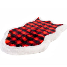 A full view of an orthopedic dog bed with red and black checkered pattern