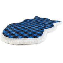 A curved furry dog bed with blue and black checkered pattern