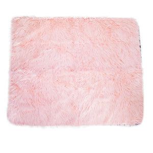 A top view of a blush pink waterproof dog blanket