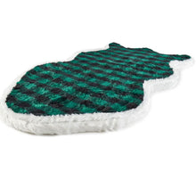 A full view of curved furry dig bed with green and black checkered pattern 