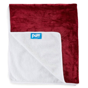 A red velvet waterproof dog blanket almost folded in half showing a logo of paw.com in white background 