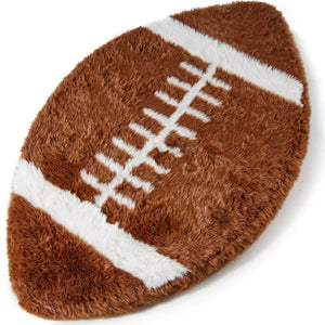 A top view of a football shaped dog bed 
