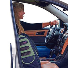 a close up image of a lady in black driving a care next to her dog in a -in-1 Pet Carrier [Backpack/Tote/Roller Bag/Carrier/Car Seat Sage