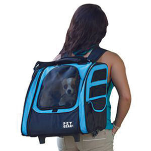 a lady carrying her dog on her back inside a 5-in-1 Pet Carrier Backpack/Tote/Roller Bag/Carrier/Car Seat, Ocean Blue