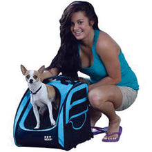 a lady sitting next to her dog that is standing on a 5-in-1 Pet Carrier Backpack/Tote/Roller Bag/Carrier/Car Seat, Ocean Blue