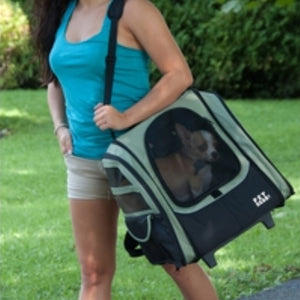 a close up image of a lady in blue dog inside a 5 in 1 dog carrier on her shoulder