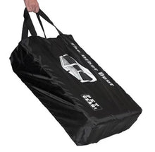 a black steel dog crate carrying bag being held by a hand
