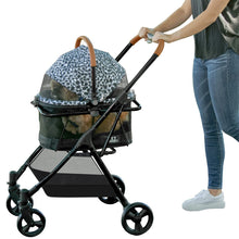 a woman pushing an animal printed design dog stroller in white background
