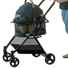 a woman pushing a balck dog stroller with white background