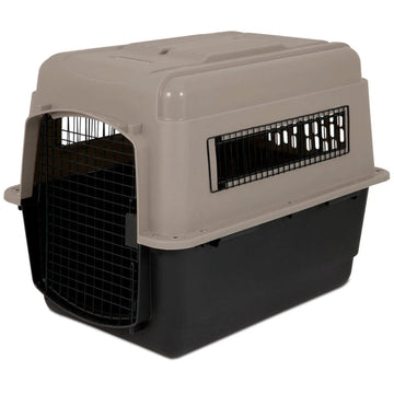 A close up image of a black and grey dog steel crate in white background