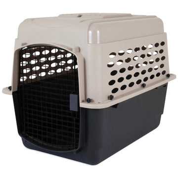 A close up image of a black and grey dog steel crate in white background