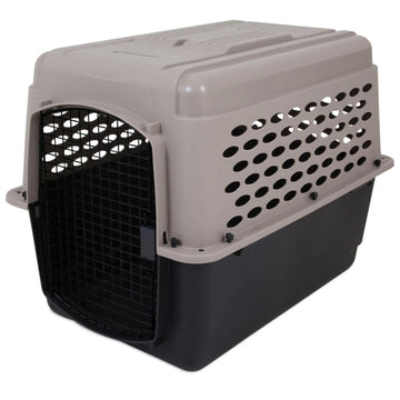 A close up image of a black and grey dog steel crate in white background